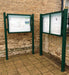 Two green landscape notice boards with posts